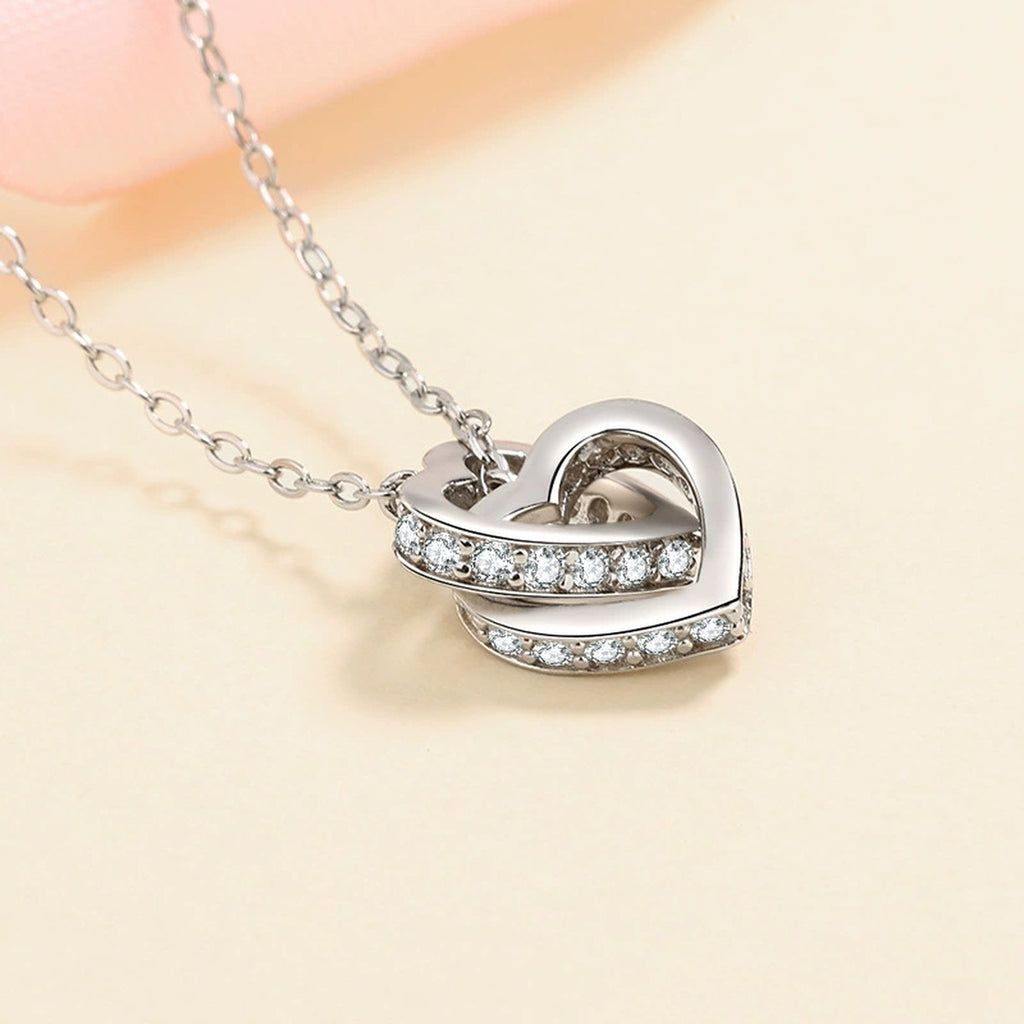 Linked Heart Moissanite Pendant Necklace in Rhodium and Rose Gold-Plated S925 sterling silver product scene view showing angled sparkle