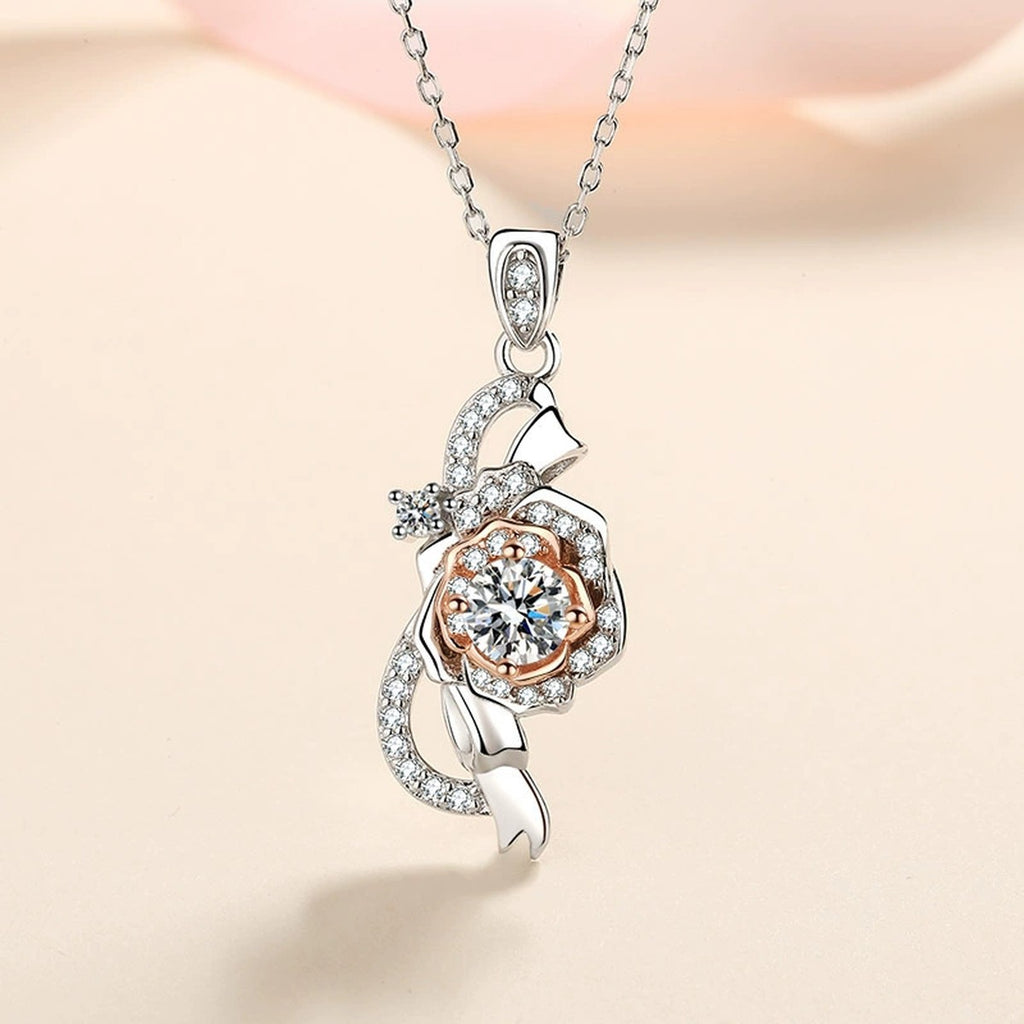 Bow Rose Moissanite Pendant Necklace with CZ in Rhodium and Rose Gold-Plated S925 sterling silver product scene view showing angled sparkle