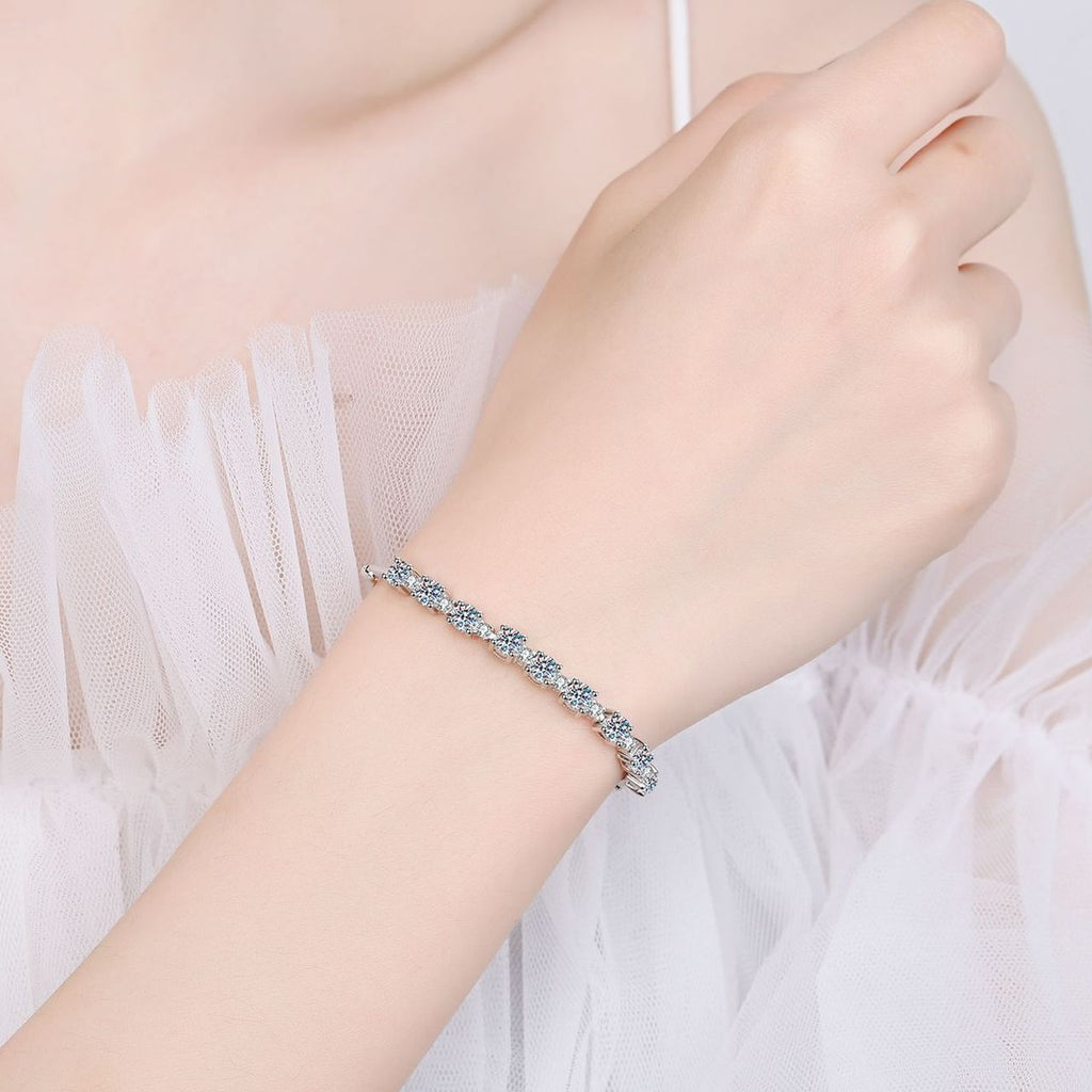 Graduated Tennis Moissanite Adjustable Bracelet in Rhodium-Plated S925 sterling silver worn on wrist model view showing scale and adjustable fit