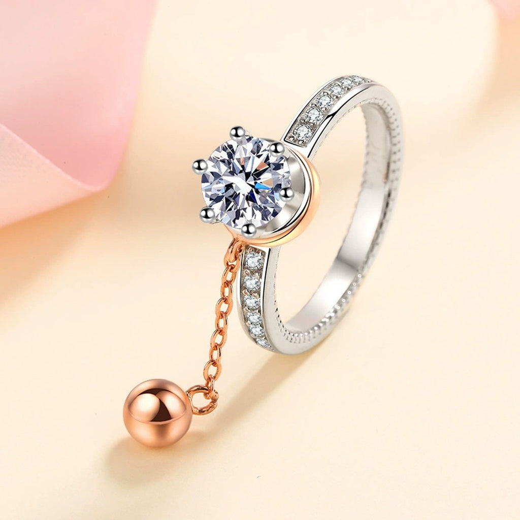 Round Moissanite Side Stone Engagement Ring with CZ worn on hand to show scale, band width, and ring profile