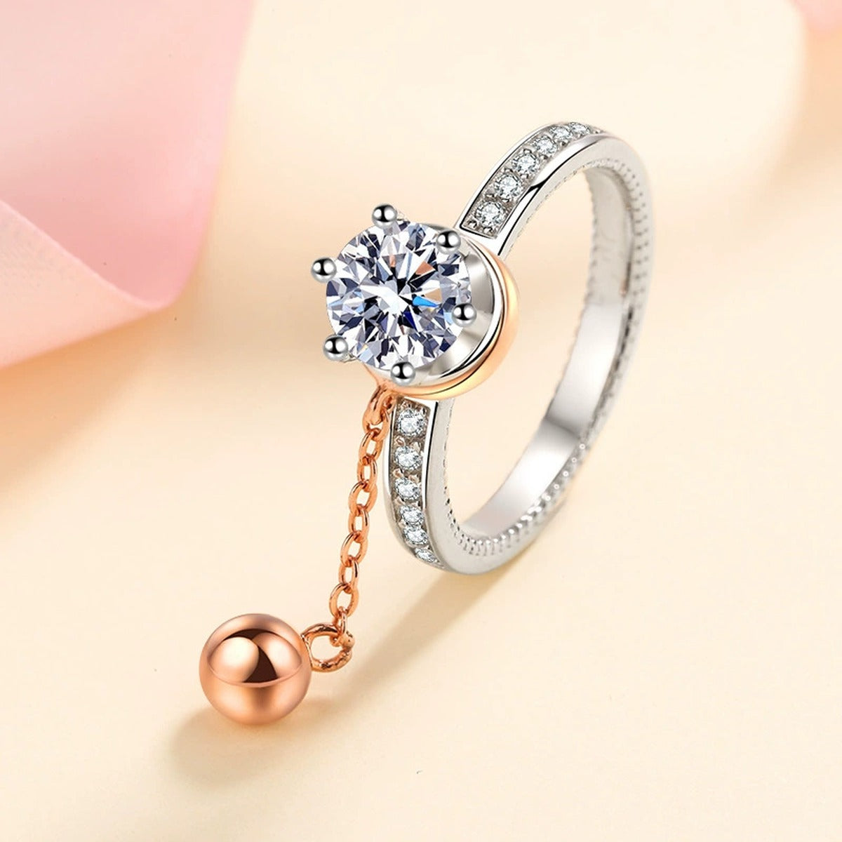 Round Moissanite Side Stone Engagement Ring with CZ worn on hand to show scale, band width, and ring profile