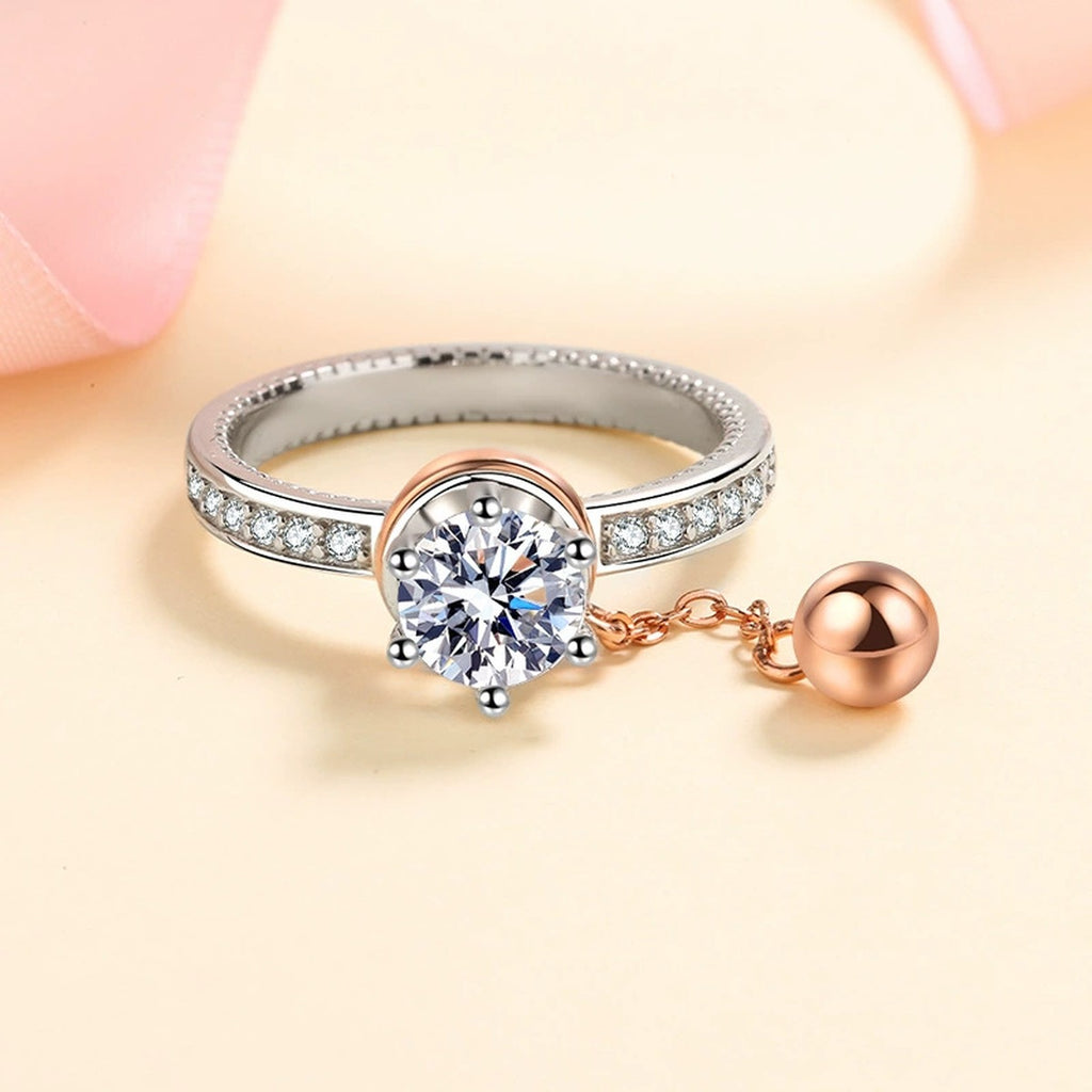 Round Moissanite Side Stone Engagement Ring with CZ worn on hand to show scale, band width, and ring profile