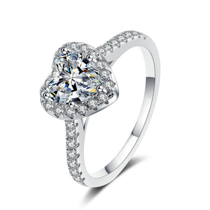 Heart Moissanite Ring with CZ in Rhodium-Plated S925 Sterling Silver clean white background product photo showing the ring silhouette and moissanite setting