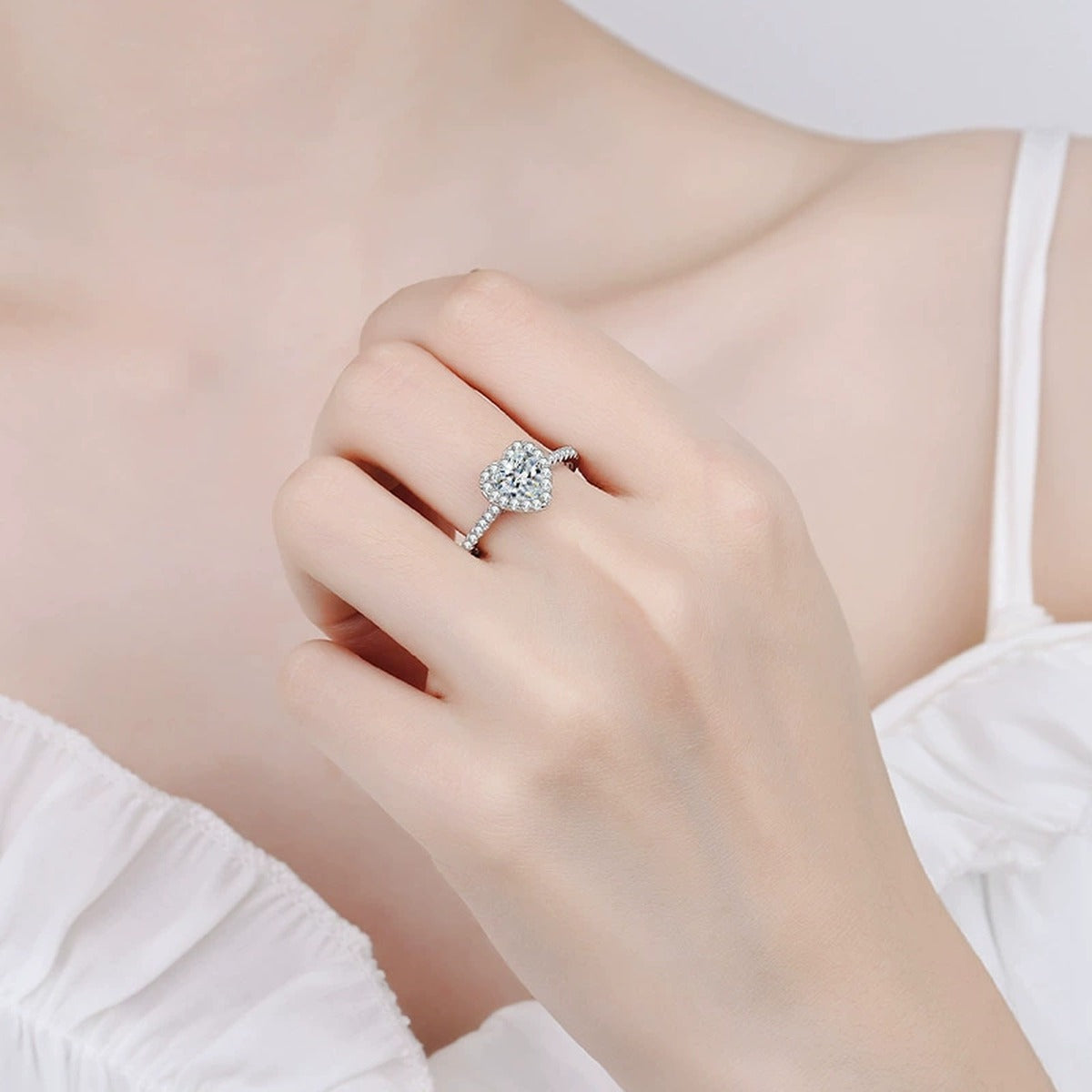 Heart Moissanite Ring with CZ in Rhodium-Plated S925 Sterling Silver worn on hand, showing scale, finger coverage, and rhodium-plated finish