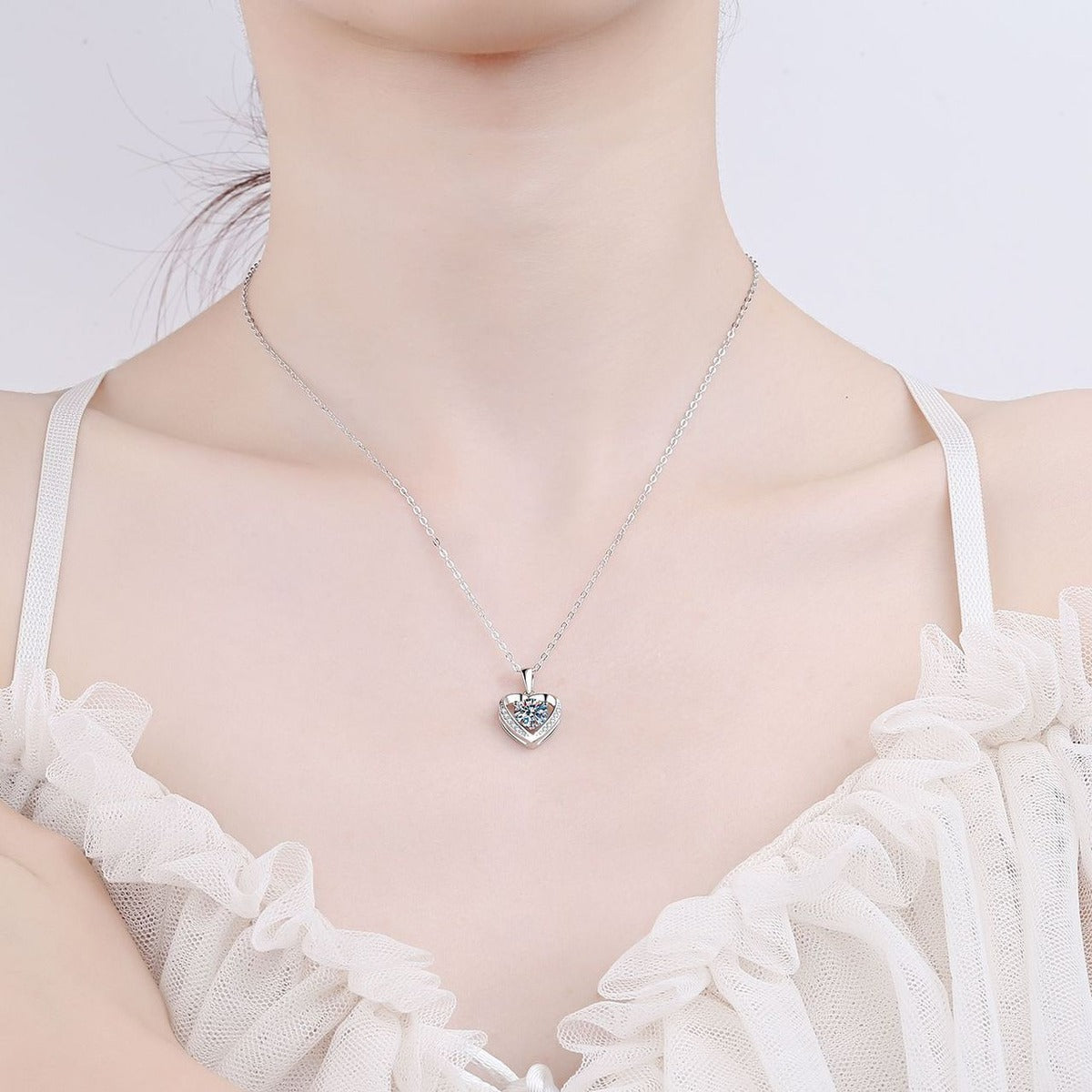 Heart Halo Round Moissanite Necklace with CZ in Rhodium-Plated S925 sterling silver neckline model view showing pendant scale and adjustable chain
