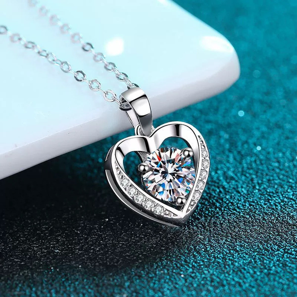 Heart Halo Round Moissanite Necklace with CZ in Rhodium-Plated S925 sterling silver blue display scene showing chain and stone layout
