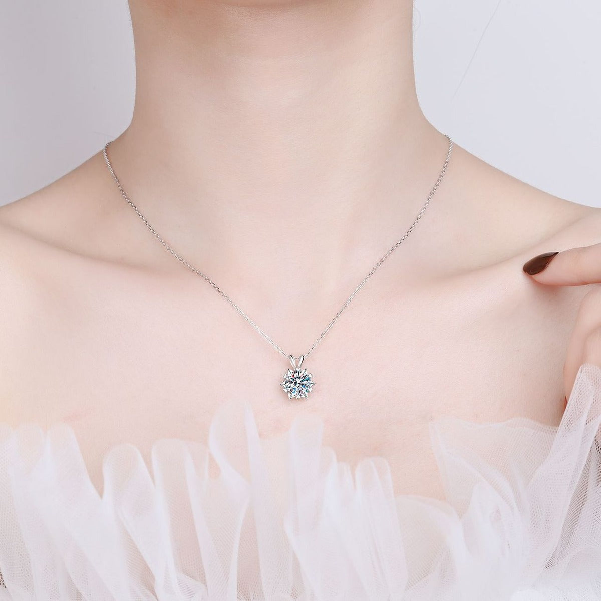 Six-Point Star Moissanite Pendant Necklace in Rhodium-Plated S925 sterling silver worn on neckline by model showing scale and adjustable chain styling