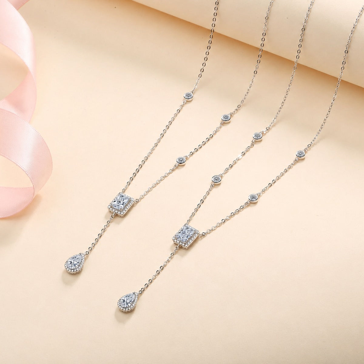Radiant and Pear Moissanite Charm Necklace with CZ in Rhodium-Plated S925 sterling silver product scene view showing pendant detail