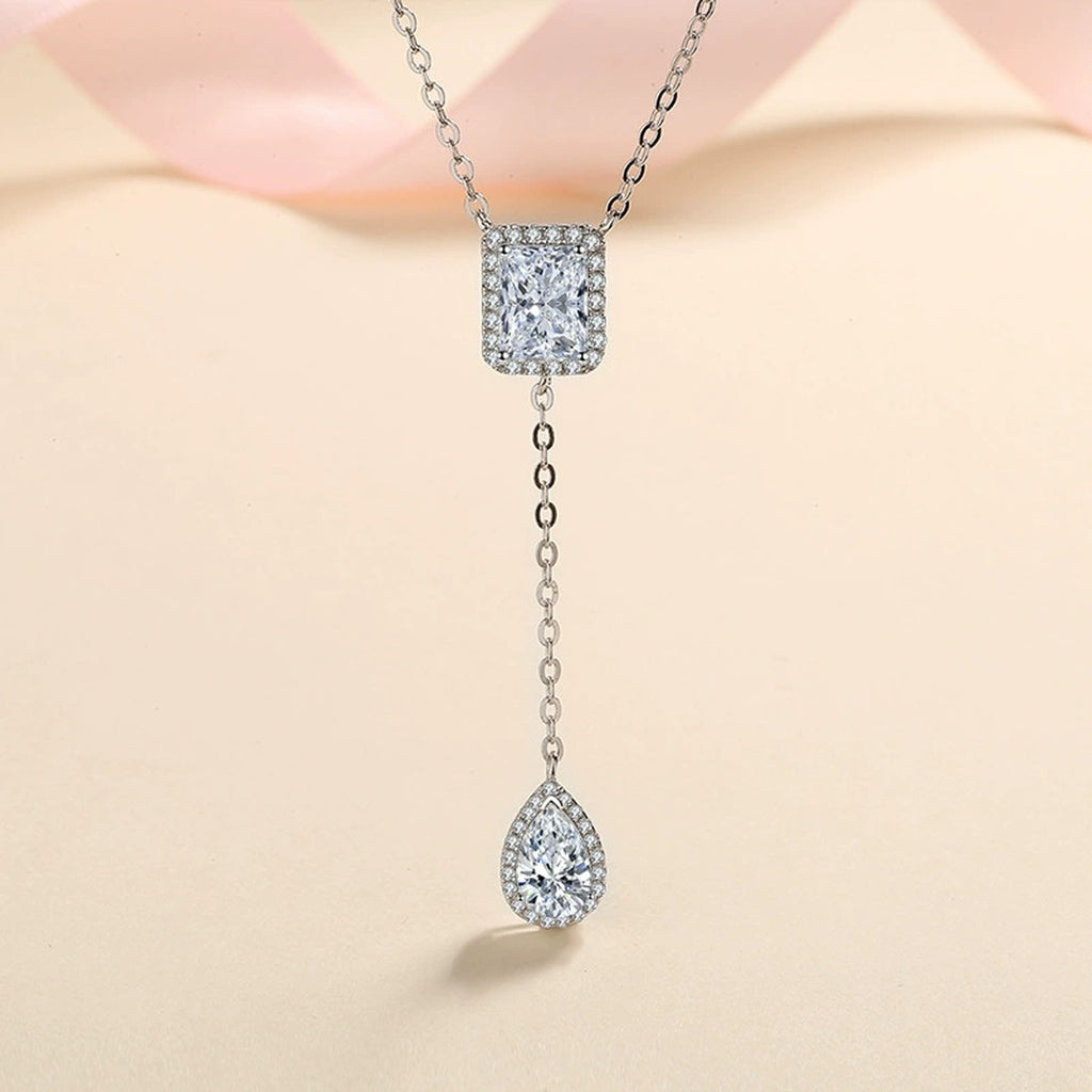 Radiant and Pear Moissanite Charm Necklace with CZ in Rhodium-Plated S925 sterling silver product scene view showing angled sparkle