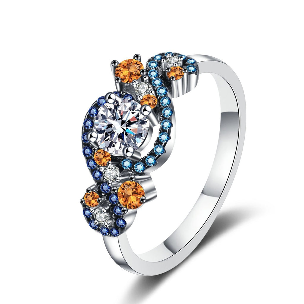 Round Moissanite Statement Ring with Blue and Orange CZ in rhodium-plated S925 sterling silver on clean white background