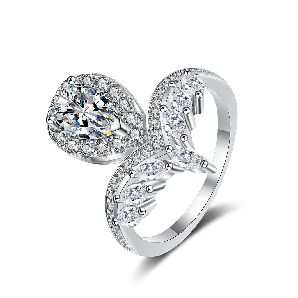 Pear Cut Moissanite Side Stone Engagement Ring with CZ in rhodium-plated S925 sterling silver on clean white background