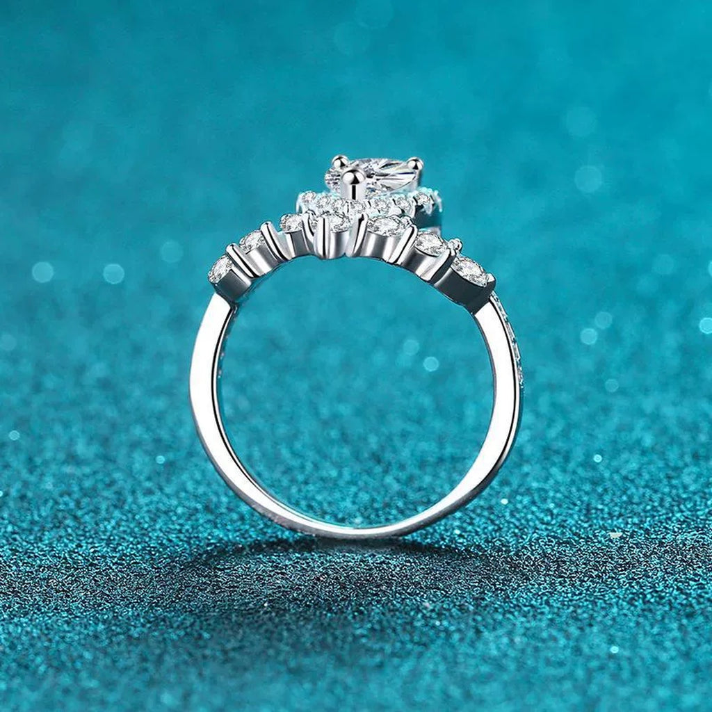 Pear Cut Moissanite Side Stone Engagement Ring with CZ product view showing moissanite setting and metal finish