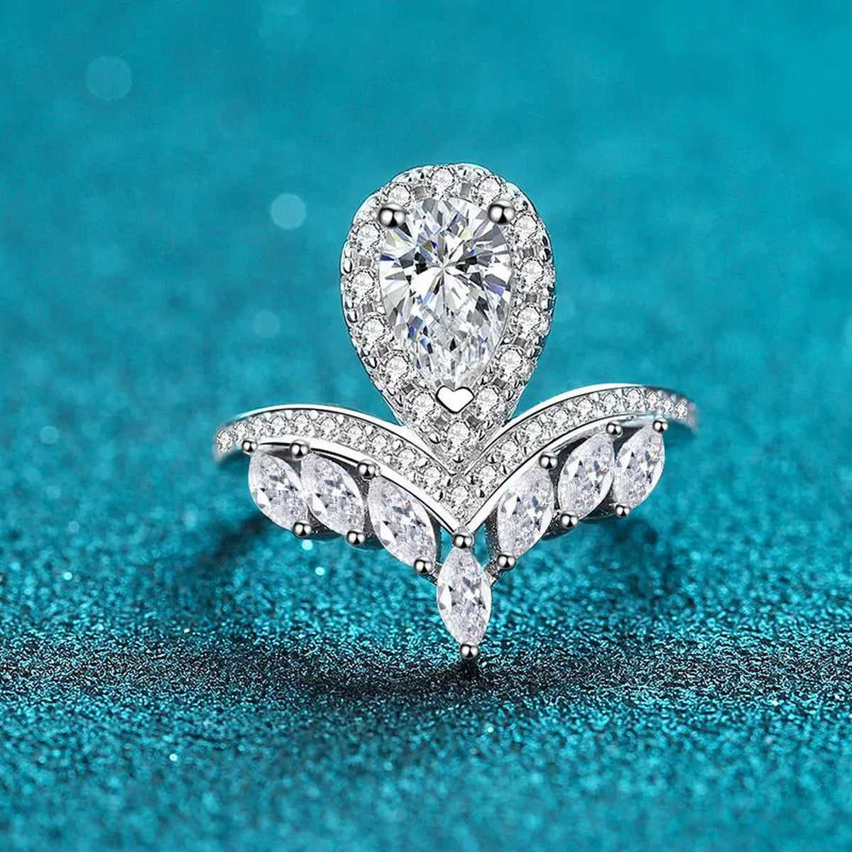 Pear Cut Moissanite Side Stone Engagement Ring with CZ product view showing moissanite setting and metal finish