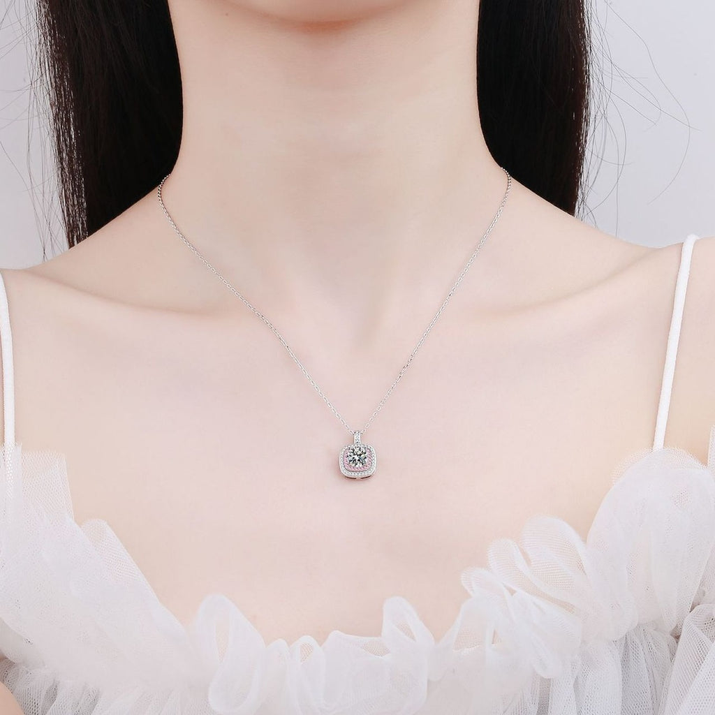 Pink Cushion Halo Moissanite Pendant Necklace with CZ in Rhodium-Plated S925 sterling silver worn on neckline by model showing scale and adjustable chain styling
