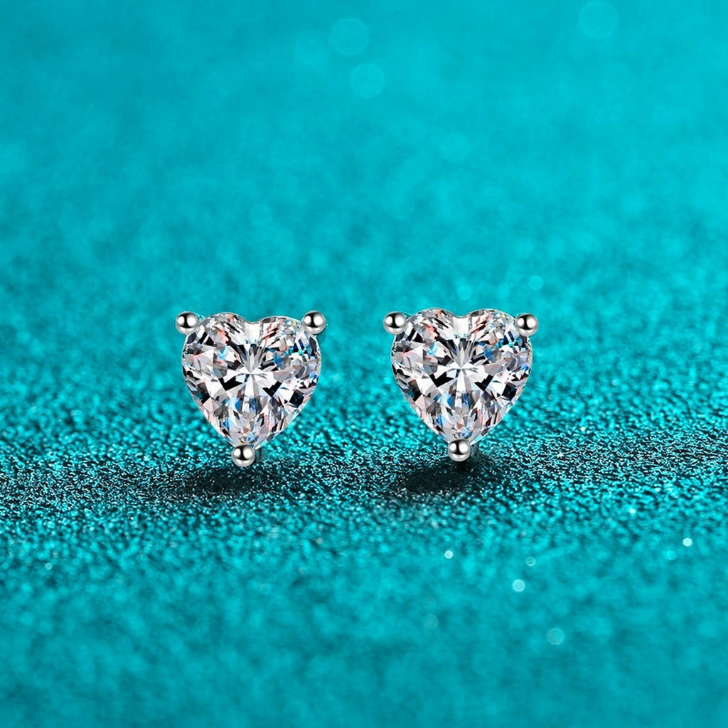 Heart Cut Moissanite Stud Earrings in Rhodium-Plated S925 sterling silver product scene view showing front sparkle