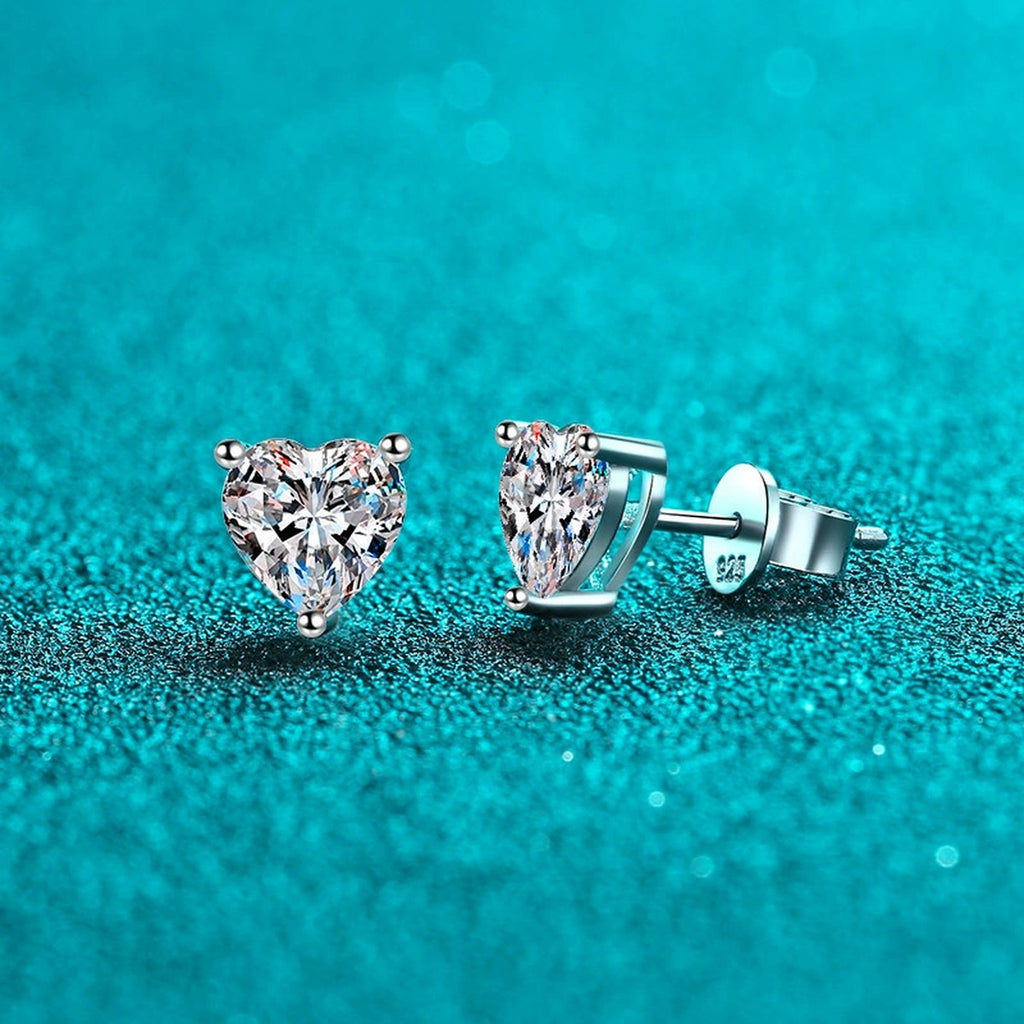 Heart Cut Moissanite Stud Earrings in Rhodium-Plated S925 sterling silver product scene view showing angled setting detail