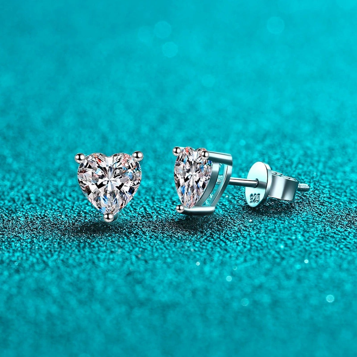 Heart Cut Moissanite Stud Earrings in Rhodium-Plated S925 sterling silver product scene view showing angled setting detail
