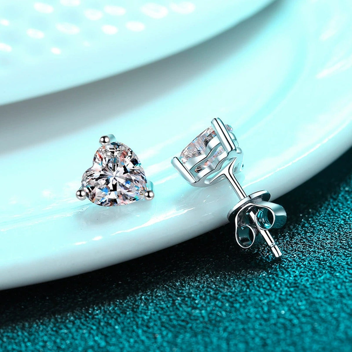 Heart Cut Moissanite Stud Earrings in Rhodium-Plated S925 sterling silver product scene view showing side profile