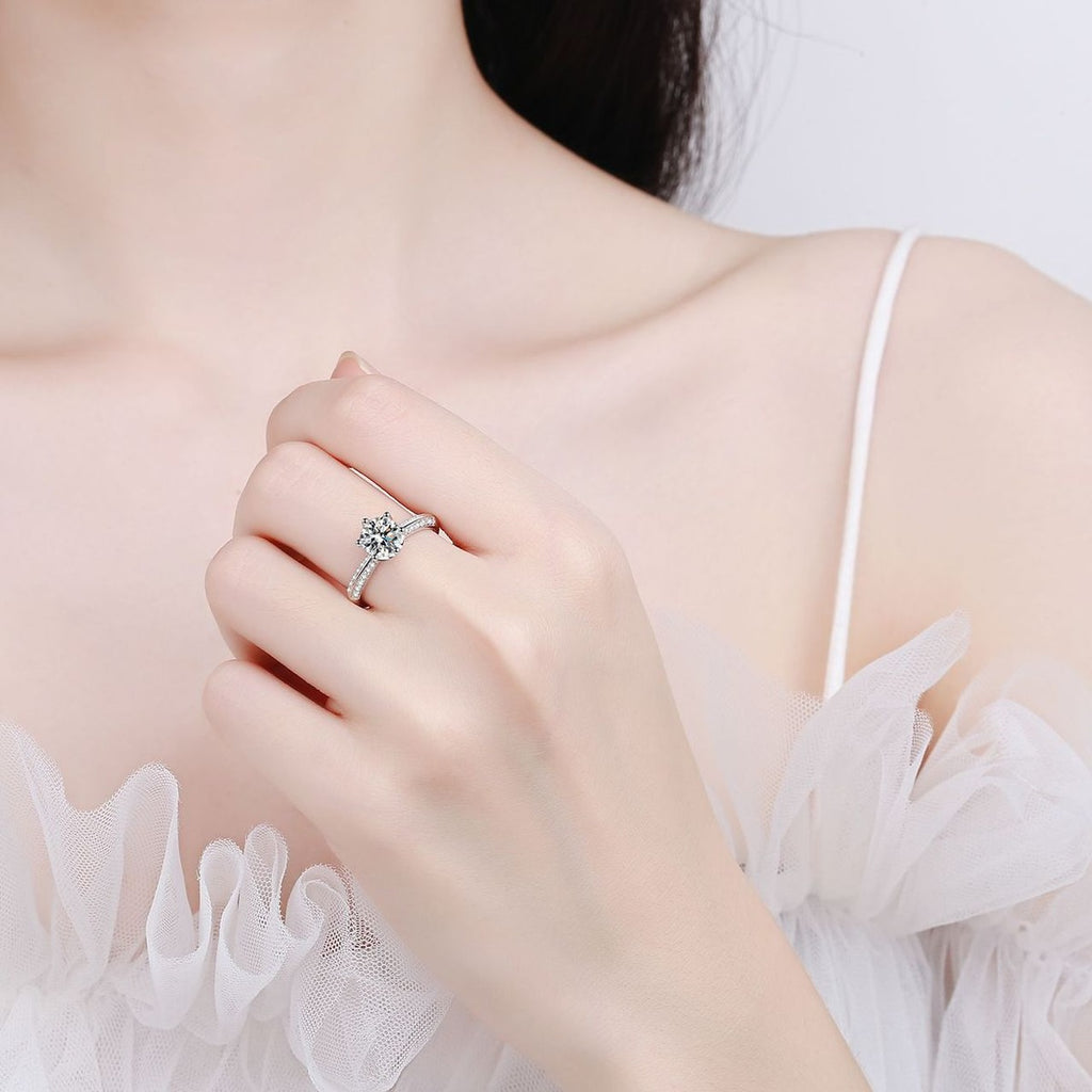 Round Moissanite Adjustable Side Stone Ring with CZ worn on hand to show scale, band width, and ring profile