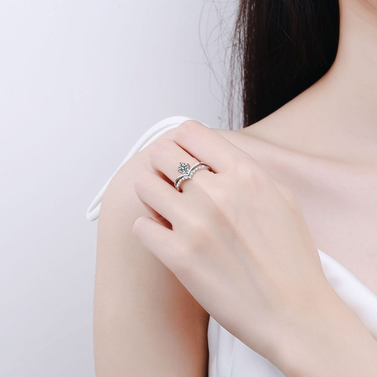 Round Moissanite Chevron Ring with CZ worn on hand to show scale, band width, and ring profile