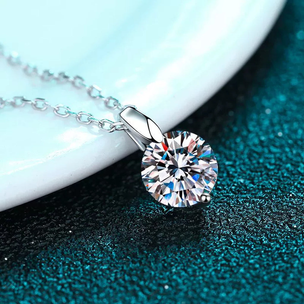 Solitaire Moissanite Pendant Necklace in Rhodium-Plated S925 sterling silver product scene view showing chain and setting detail