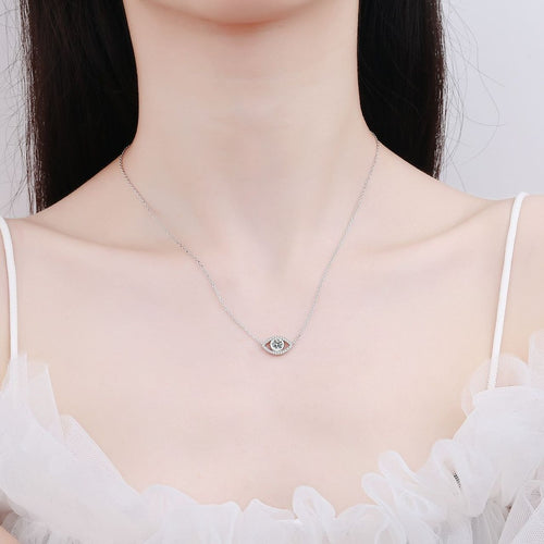 All-Seeing Eye Moissanite Pendant Necklace with CZ in Rhodium-Plated S925 sterling silver worn on neckline by model showing scale and adjustable chain styling