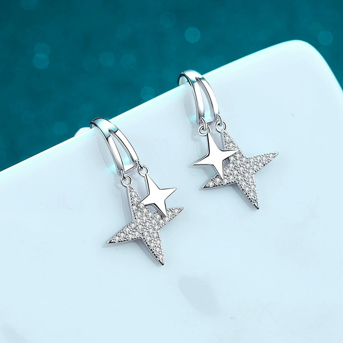 Star Moissanite Stud Dangle Earrings in Rhodium-Plated S925 sterling silver product scene view showing front sparkle