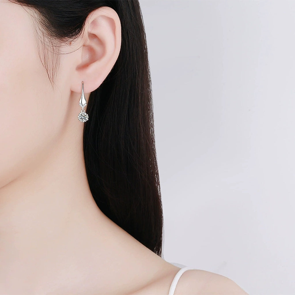 Round Moissanite Hook Drop Earrings with CZ in Rhodium-Plated S925 sterling silver worn on ear by model showing scale, placement, and hook drop earrings styling