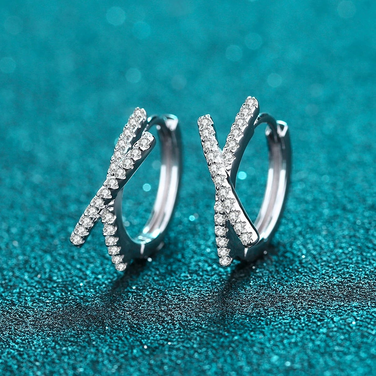 Twist Moissanite Huggie Hoop Earrings in Rhodium-Plated S925 sterling silver product scene view showing front sparkle
