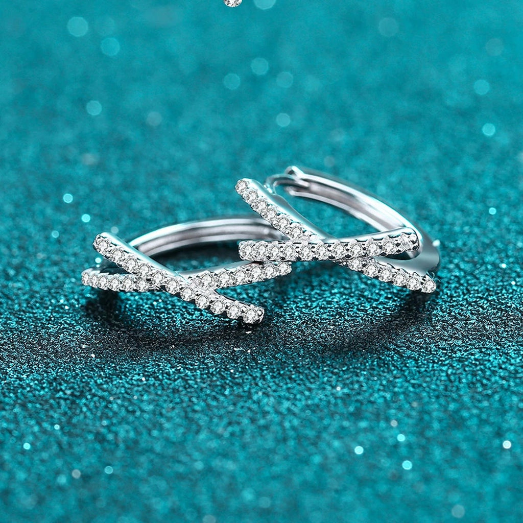Twist Moissanite Huggie Hoop Earrings in Rhodium-Plated S925 sterling silver product scene view showing angled setting detail