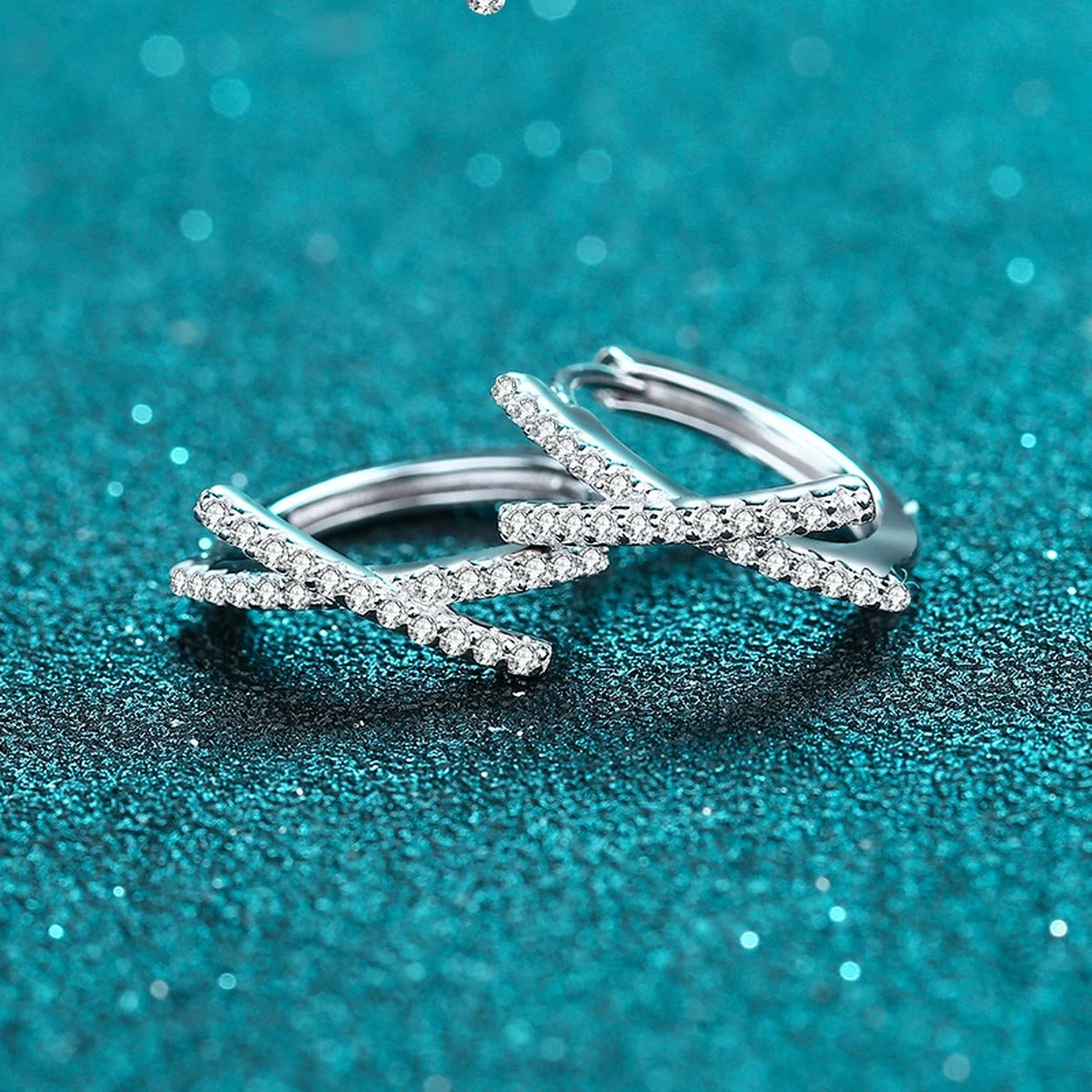 Twist Moissanite Huggie Hoop Earrings in Rhodium-Plated S925 sterling silver product scene view showing angled setting detail