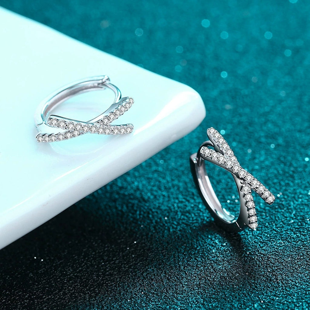 Twist Moissanite Huggie Hoop Earrings in Rhodium-Plated S925 sterling silver product scene view showing side profile