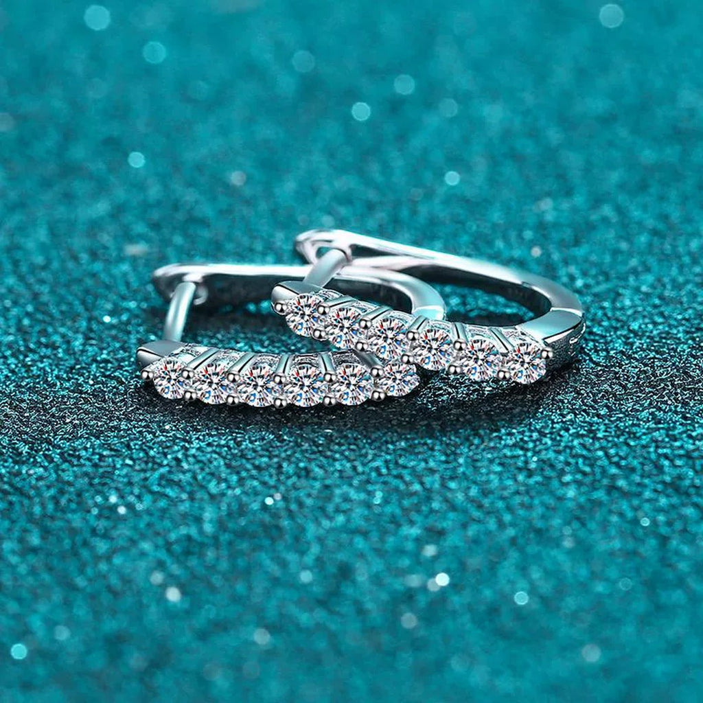 Pave Moissanite Huggie Hoop Earrings in Rhodium-Plated S925 sterling silver product scene view showing angled setting detail