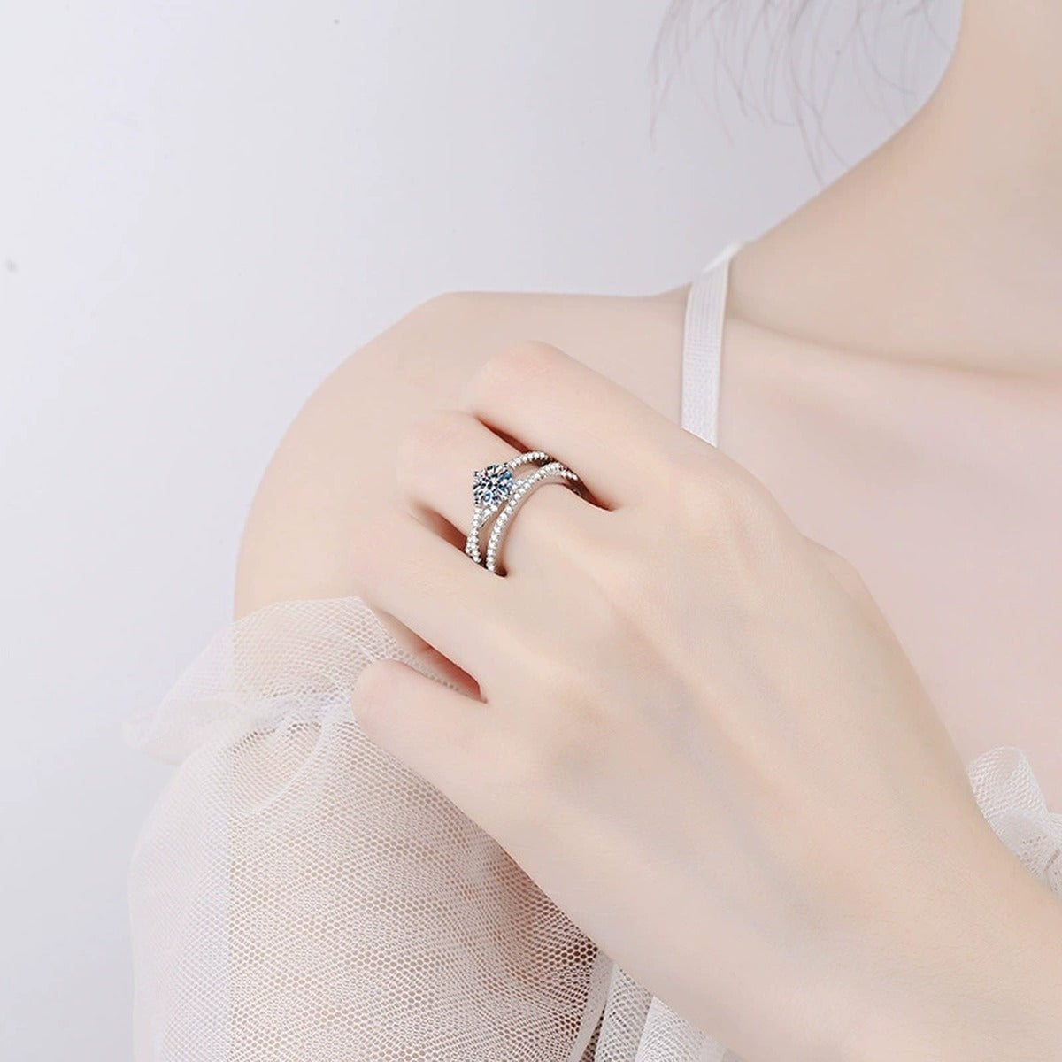 Round Moissanite Split Shank Ring with CZ worn on hand to show scale and ring profile