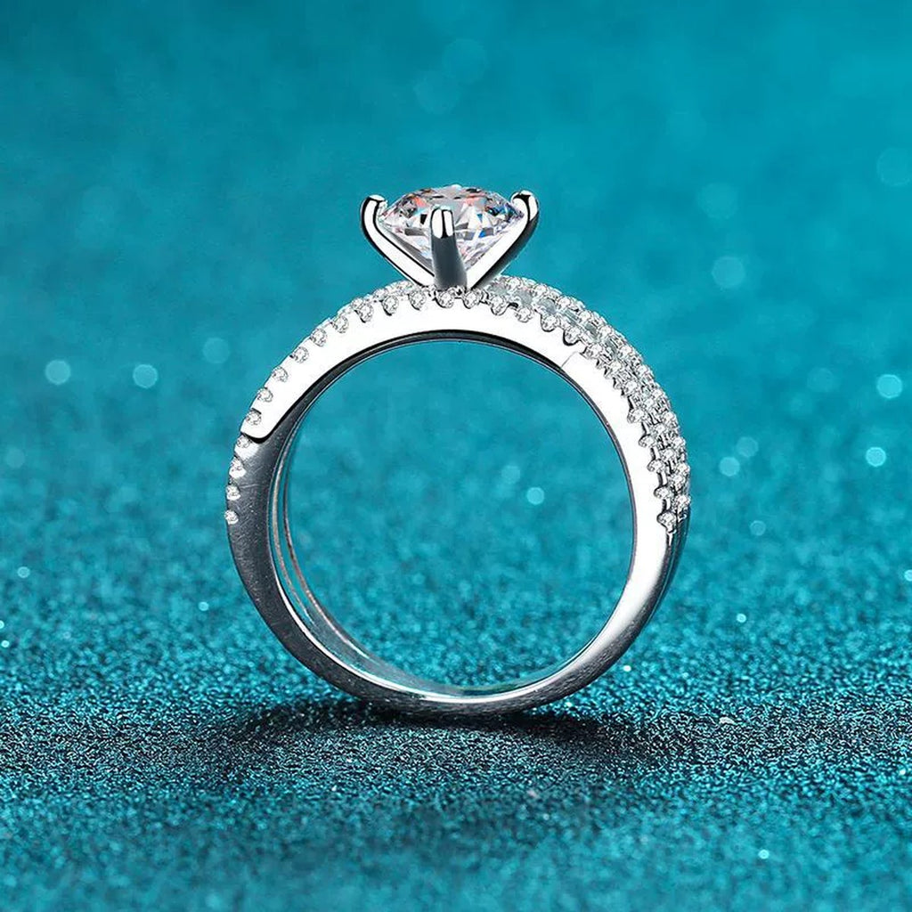 Round Moissanite Split Shank Ring with CZ product view showing moissanite setting and rhodium finish