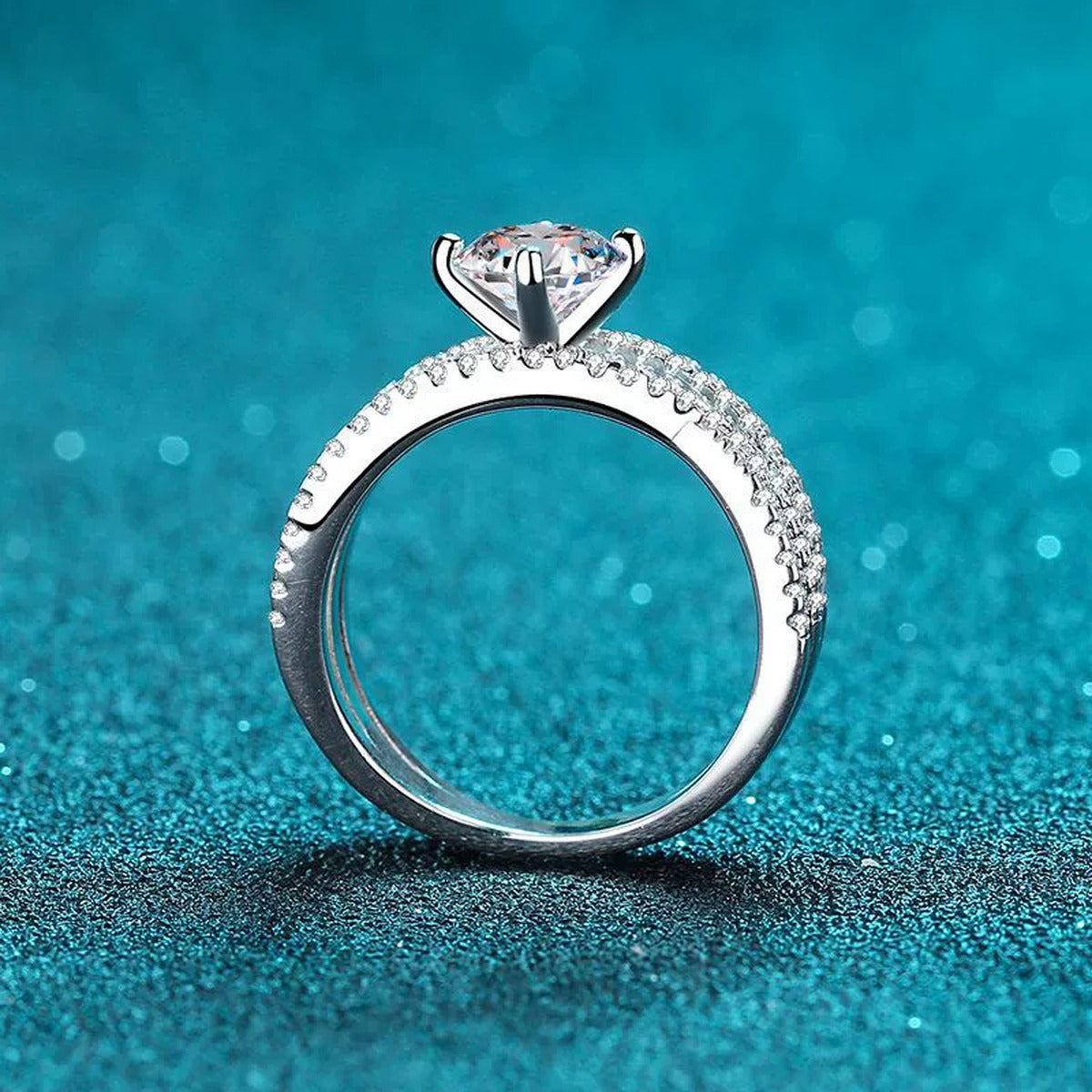 Round Moissanite Split Shank Ring with CZ product view showing moissanite setting and rhodium finish