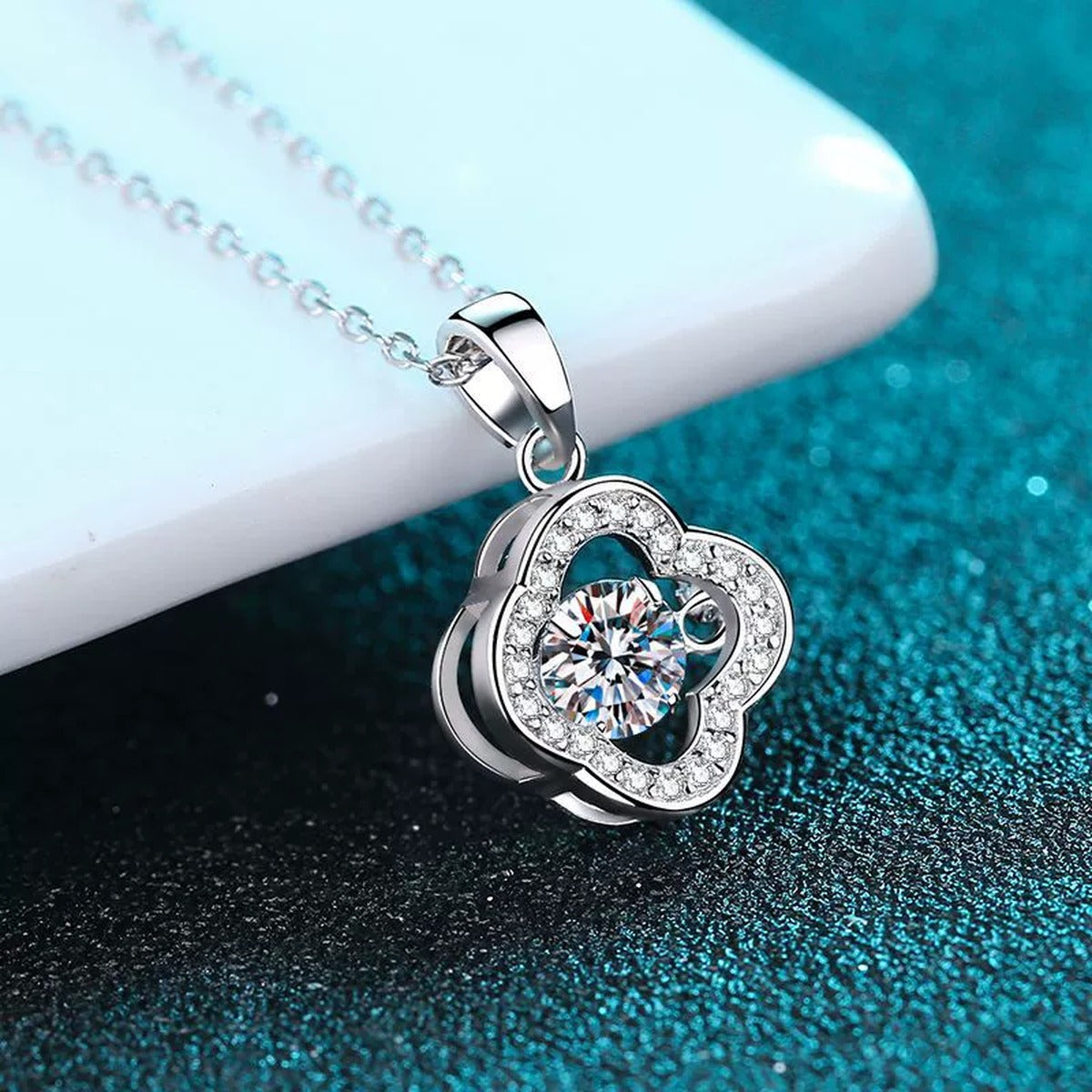 Clover Round Moissanite Necklace with CZ in Rhodium-Plated S925 sterling silver blue display scene showing chain and stone layout