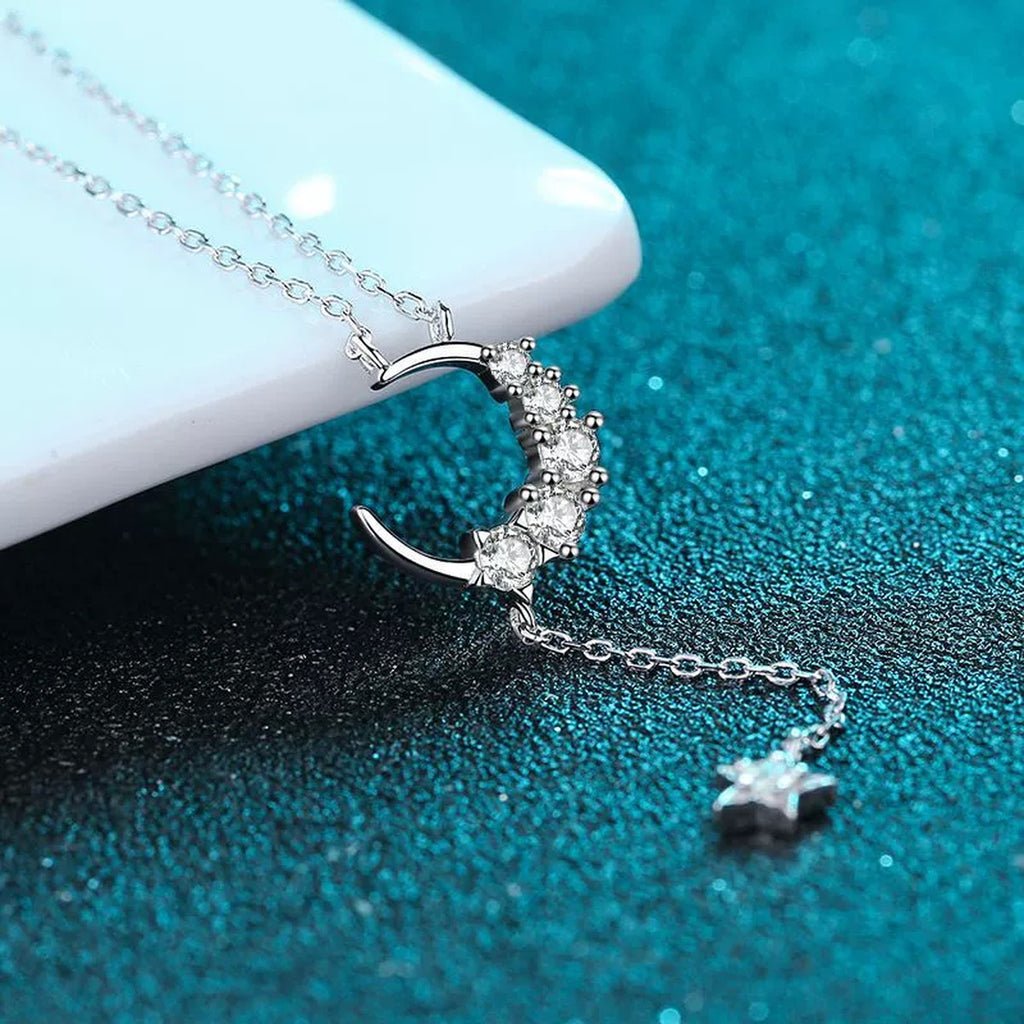 Moon and Star Moissanite Pendant Necklace in Rhodium-Plated S925 sterling silver product scene view showing angled sparkle