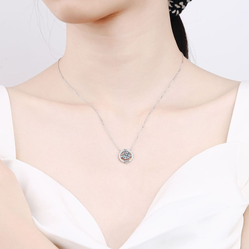 Halo Moissanite Pendant Necklace with CZ in Rhodium-Plated S925 sterling silver worn on neckline by model showing scale and adjustable chain styling