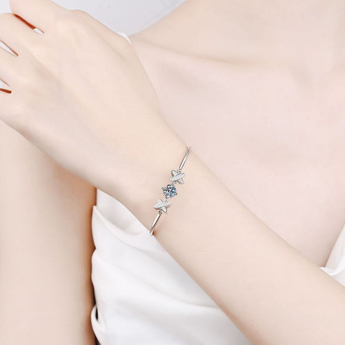 Butterfly Moissanite Bangle Bracelet with CZ in Rhodium-Plated S925 sterling silver worn on wrist model view showing scale and adjustable fit