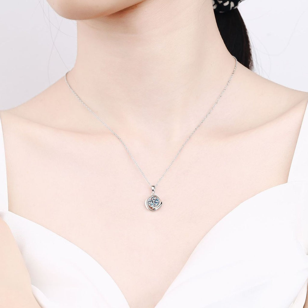 Solitaire Moissanite Pendant Necklace in Rhodium-Plated S925 sterling silver worn on neckline by model showing scale and adjustable chain styling