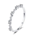 Delicate Round Moissanite Band Ring in rhodium-plated S925 sterling silver on clean white background