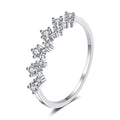 Round Moissanite Wave Band Ring in rhodium-plated S925 sterling silver on clean white background