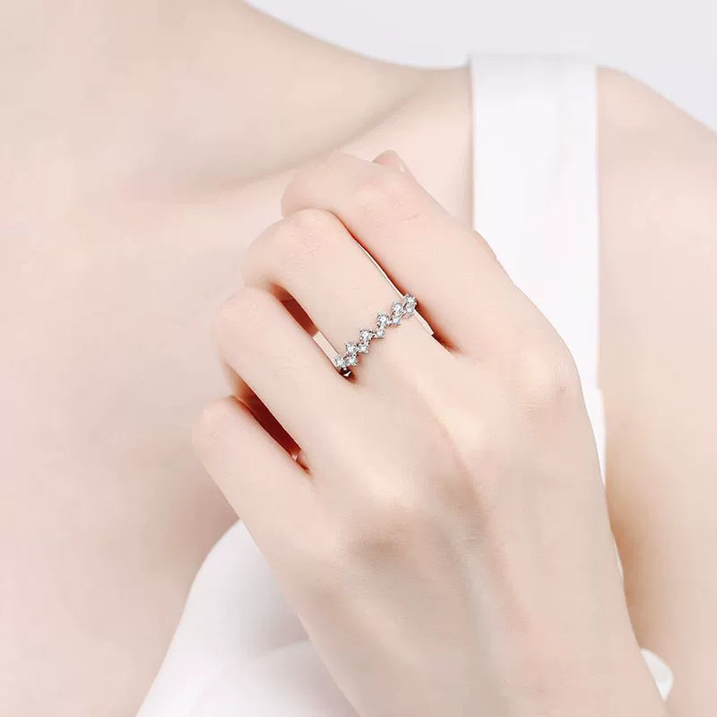 Round Moissanite Wave Band Ring worn on hand to show scale and ring profile