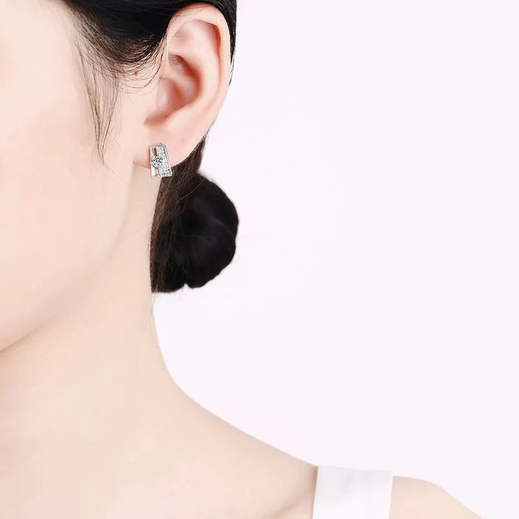 Geometric Moissanite Stud Drop Earrings with CZ in Rhodium-Plated S925 sterling silver worn on ear by model showing scale, placement, and stud earrings styling