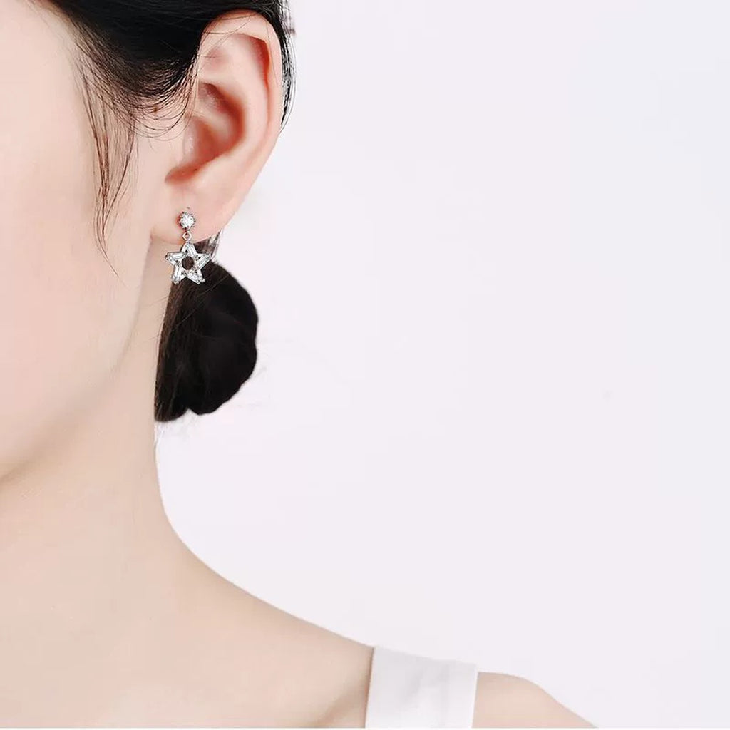 Star Moissanite Stud Dangle Earrings with CZ in Rhodium-Plated S925 sterling silver worn on ear by model showing scale, placement, and stud dangle earrings styling