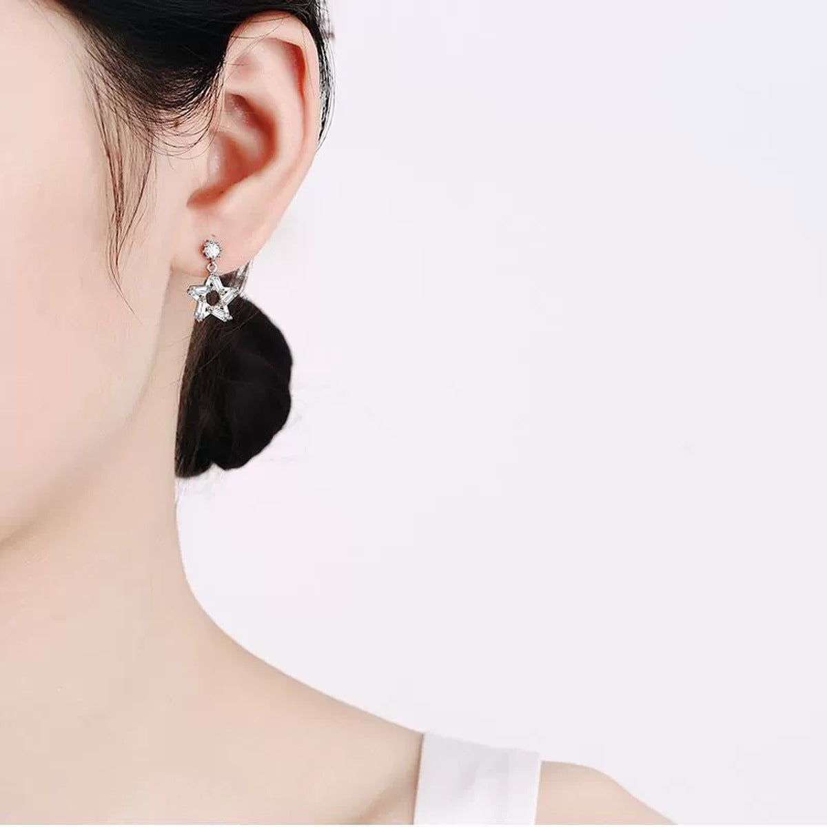 Star Moissanite Stud Dangle Earrings with CZ in Rhodium-Plated S925 sterling silver worn on ear by model showing scale, placement, and stud dangle earrings styling
