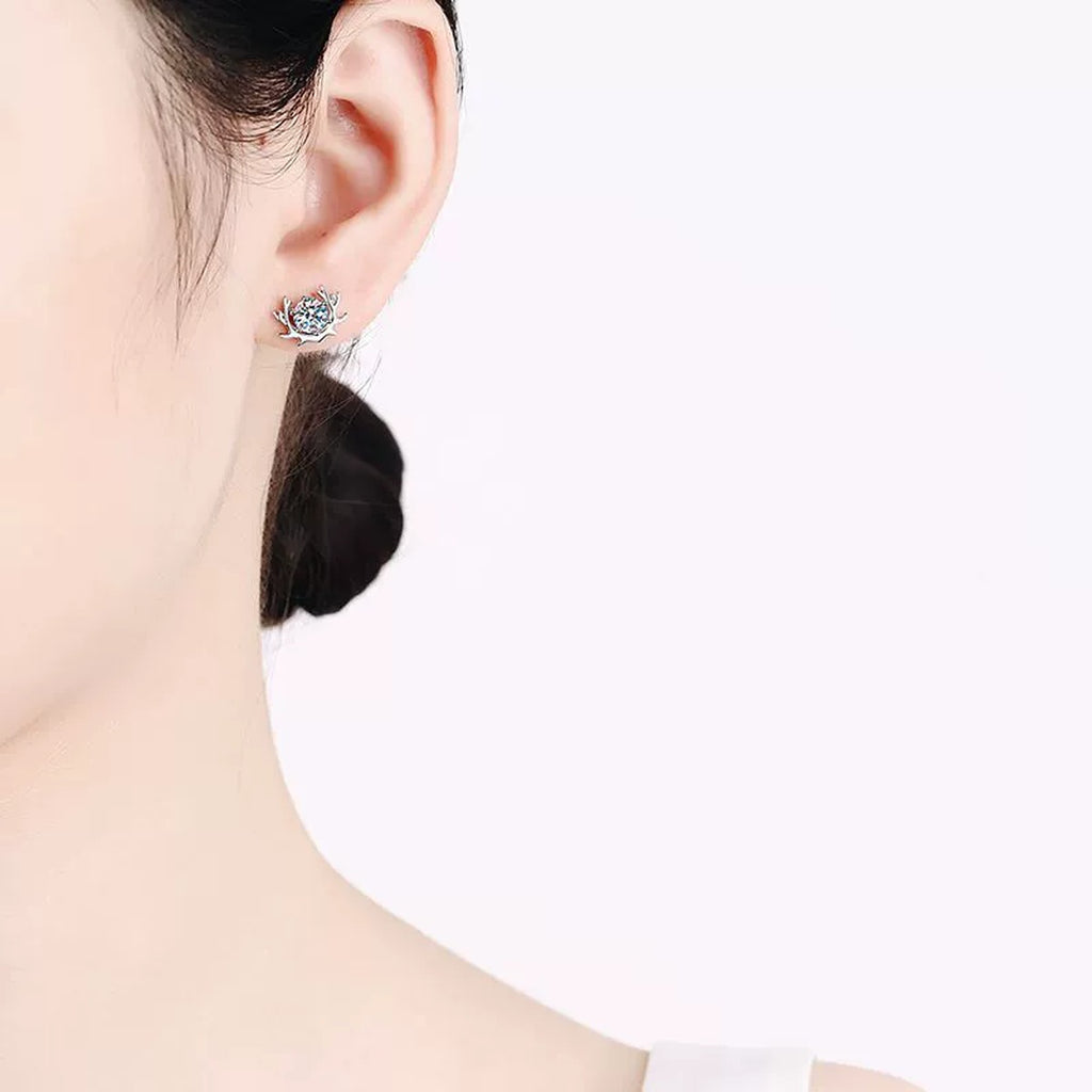 Deer Antler Moissanite Stud Earrings in Rhodium-Plated S925 sterling silver worn on ear by model showing scale, placement, and stud earrings styling