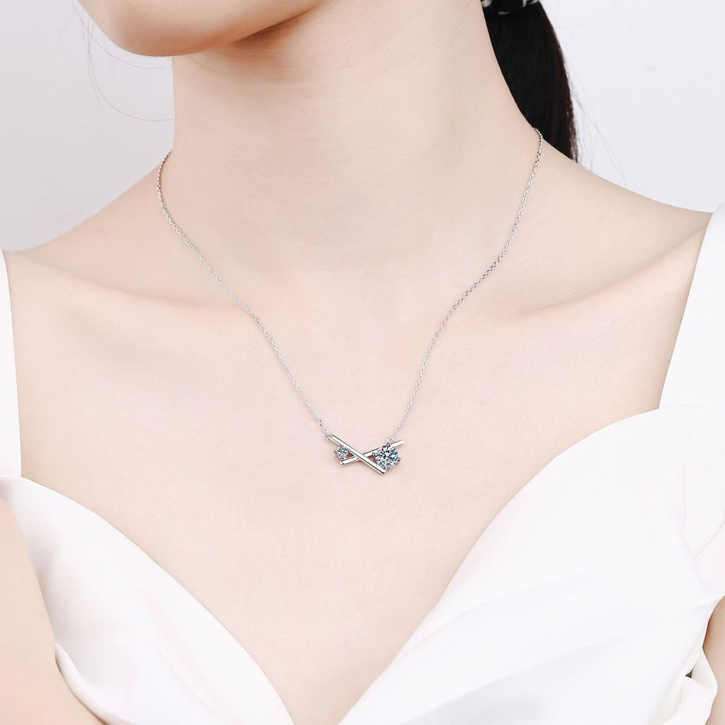 Geometric Moissanite Pendant Necklace in Rhodium-Plated S925 sterling silver worn on neckline by model showing scale and adjustable chain styling