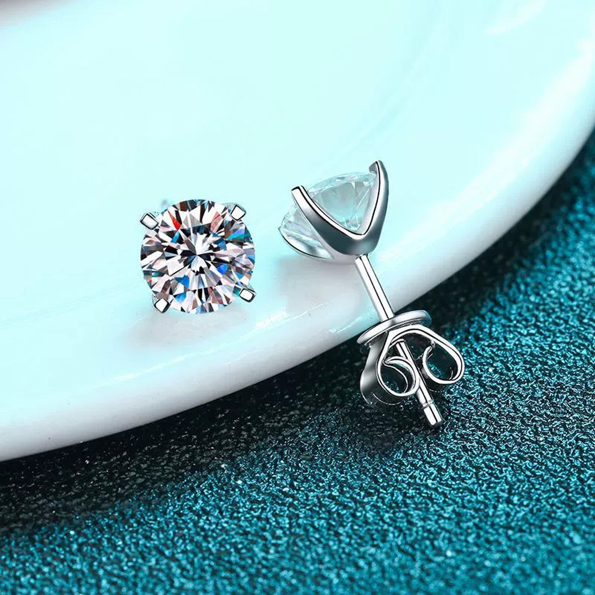 Round Moissanite Stud Earrings in Rhodium-Plated S925 sterling silver product scene view showing angled setting detail